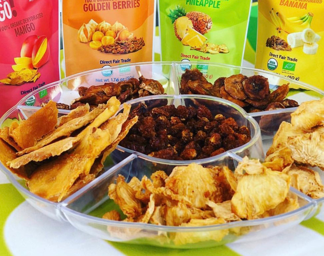 Maroon Hades 2GO! ® Organic Dried Bananas, sliced and dried, shown in a clear container with fresh dried banana pieces visible.