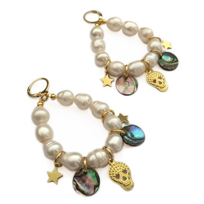 Yellow Athena Pearl Charm Earrings featuring white pearls and delicate gold hooks, close-up view of elegant jewelry.