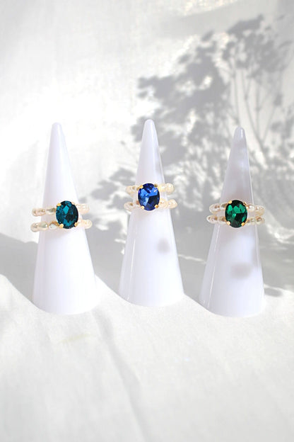 Ultramarine Birch 3 shades blue CZ and freshwater pearl rings featuring elegant band designs and sparkling gemstone accents.
