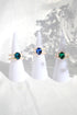 Ultramarine Birch 3 shades blue CZ and freshwater pearl rings featuring elegant band designs and sparkling gemstone accents.