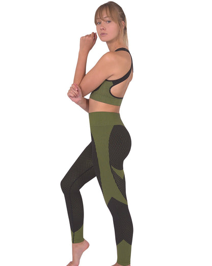 Lazurite Trois seamless black and green sports bra for activewear, shown on a model highlighting its fitted, breathable fabric.
