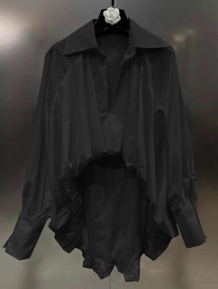 Elegant women’s minimalist asymmetric blouse by Mauve Ananke, featuring irregular design and sophisticated style.