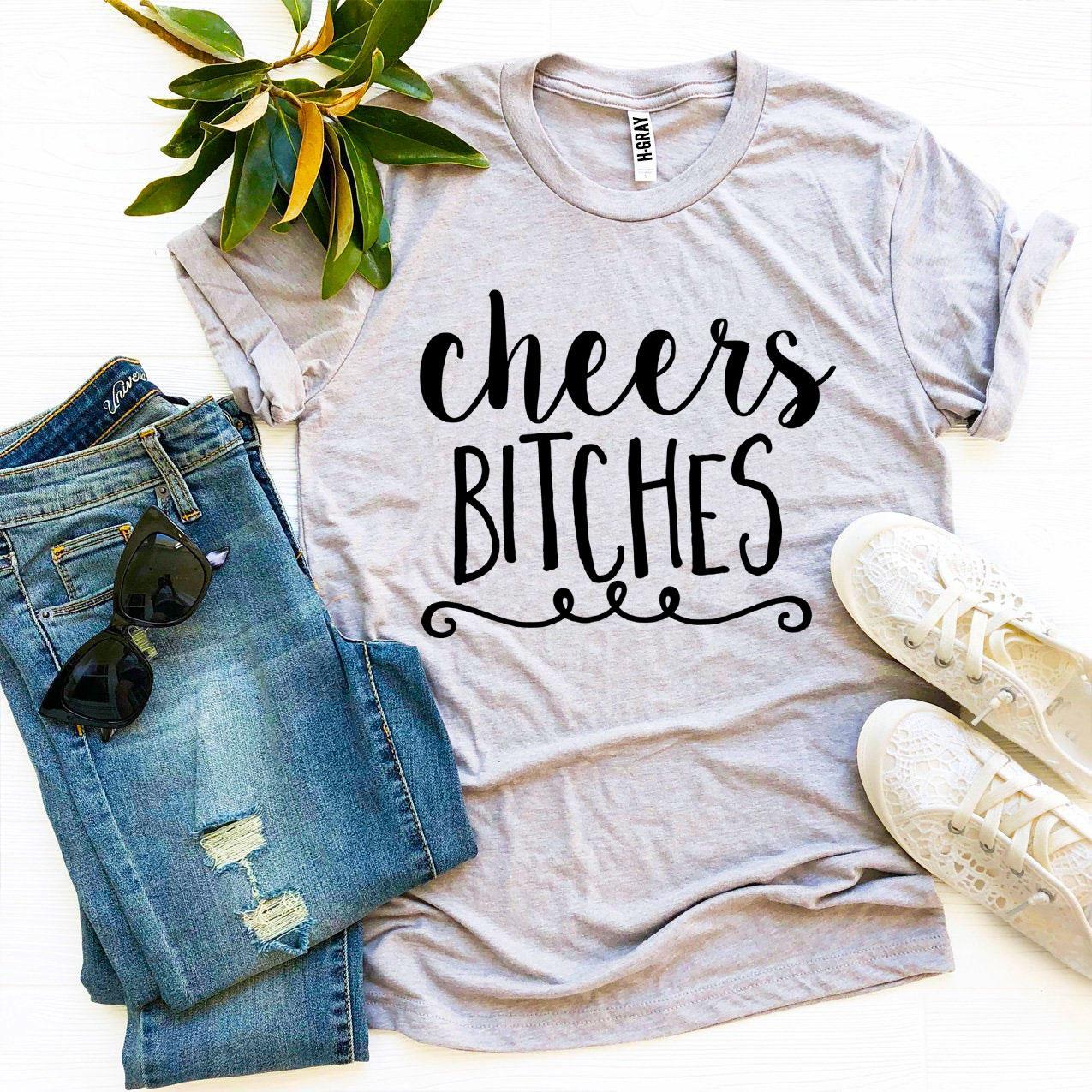 Agate Cheers Bitches T-shirt featuring bold text, casual fit, and classic short sleeves, displayed on a plain background.