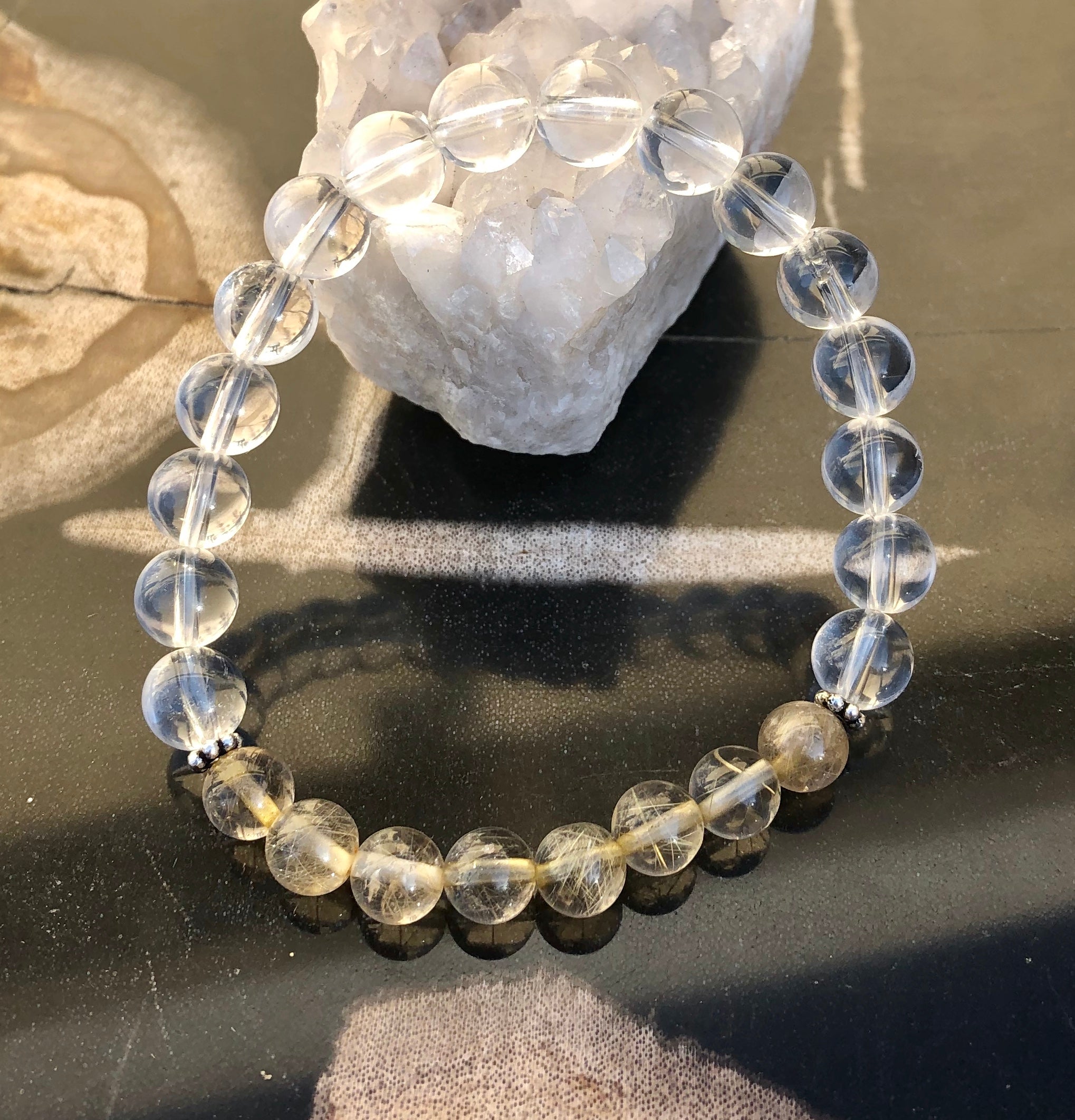 Violet Chaos Citrine Rutilated and Crystal Quartz stretch bracelet with genuine crystal beads and gold accents.