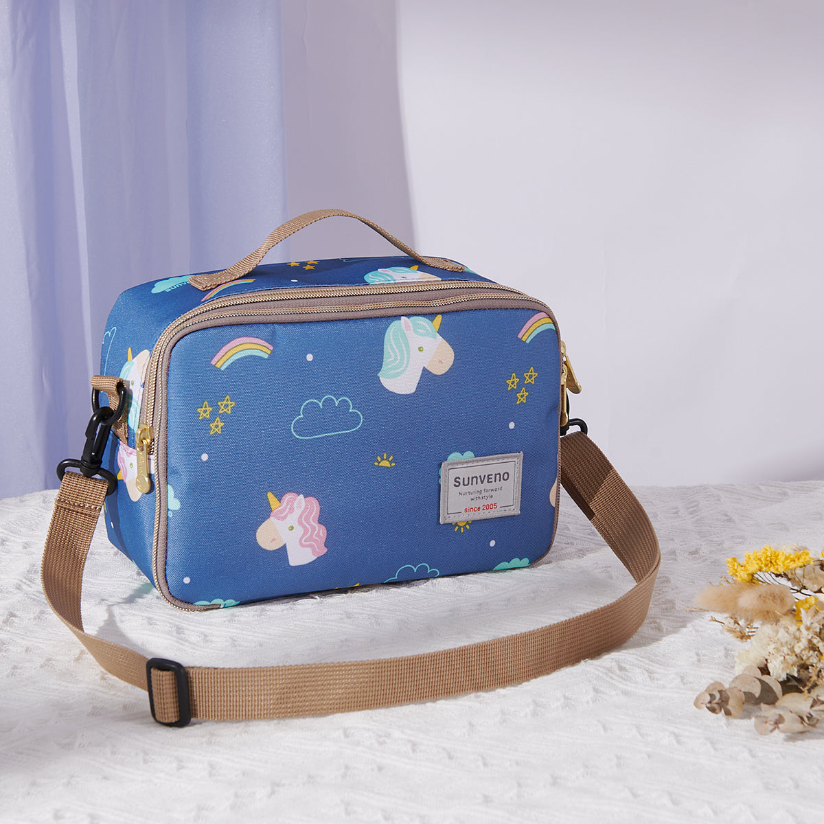 Maroon Chronos all-in-one diaper bag with changing pad, featuring multiple compartments and a modern design for parents.