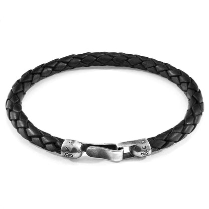 Midnight black Skye silver and braided leather bracelet by Magenta Sooty with silver accents and intricate leather weaving.