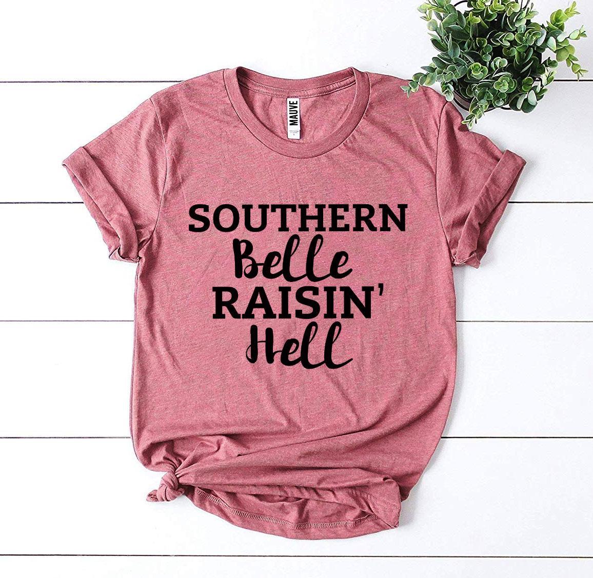 Southern Belle Raisin’ Hell T-shirt by Agate featuring a stylish black cotton tee with bold graphic print.