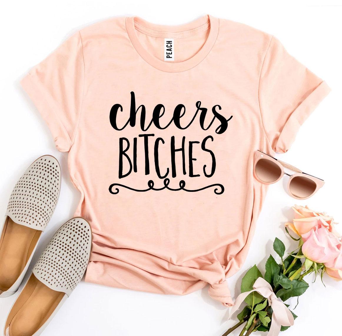 Agate Cheers Bitches T-shirt, casual black cotton T-shirt with bold white "Cheers Bitches" text, front view.