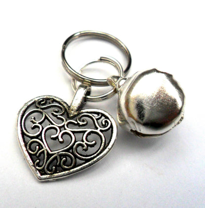 Salmon Oscar filigree heart pet charm attached to a collar, designed for leashes and petwear, showcasing intricate metalwork.