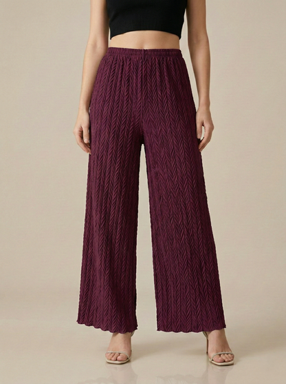 Textured pleated palazzo pants for women in a neutral color, featuring wide legs and comfortable fit from Apricot Dione.
