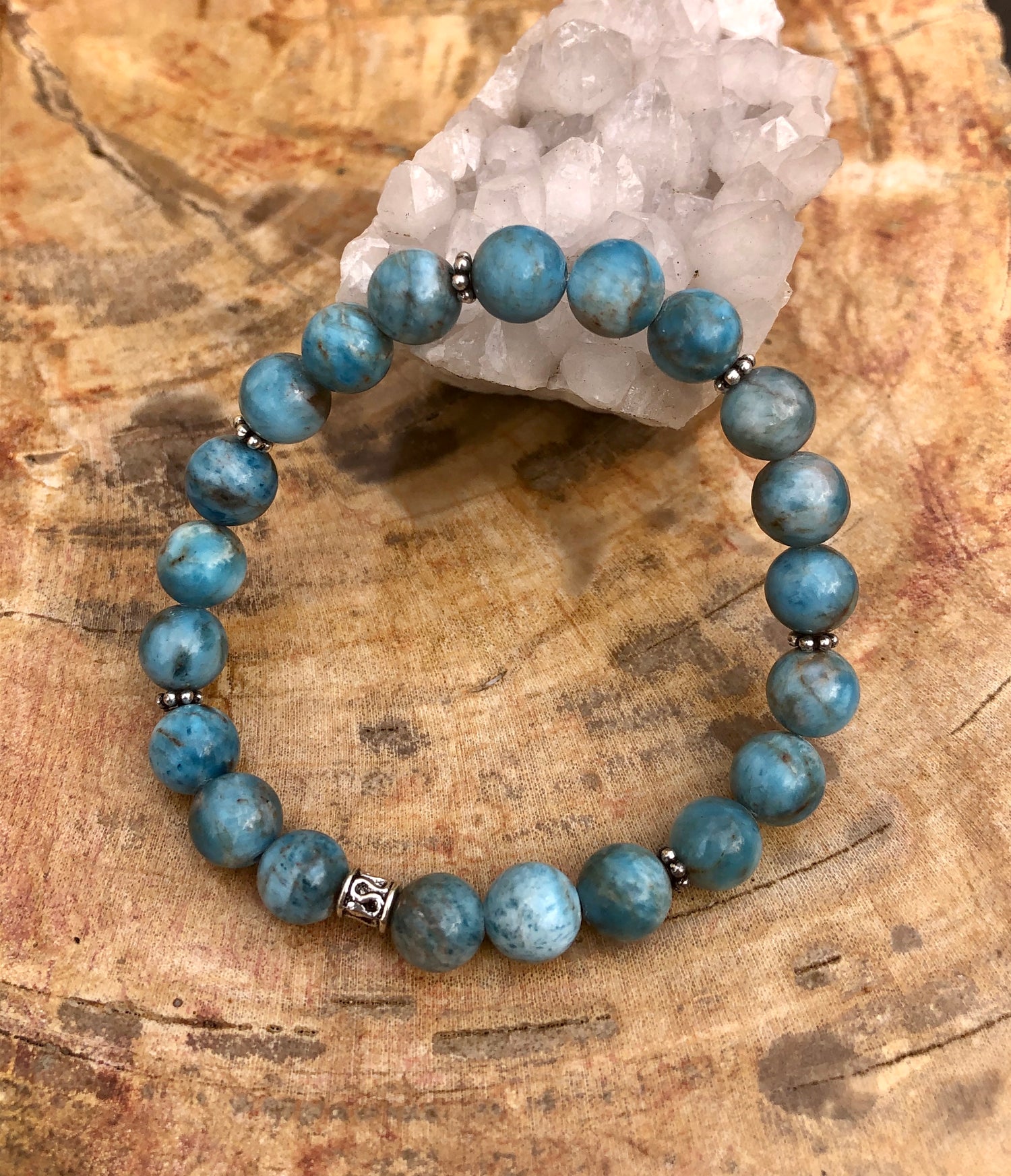 Blue Apatite stretch bracelet with natural gemstone beads, made by Violet Chaos, featuring vibrant blue stones on an elastic band.
