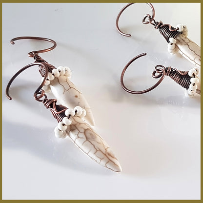 Copper wire wrapped Howlite spike earrings by Maroon Smudge featuring white spike stones and intricate wire detailing.