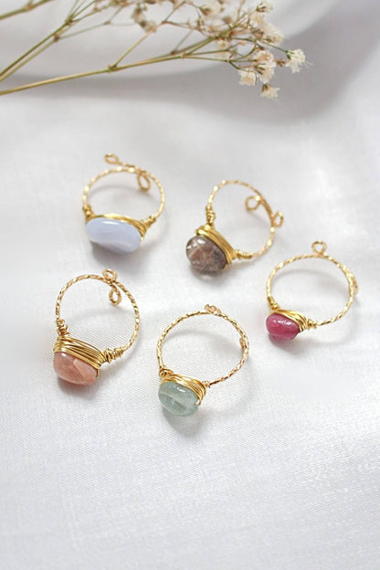 Ultramarine Birch 18K gold natural crystal hand-wired solitaire ring with intricate wirework and gemstone centerpiece.