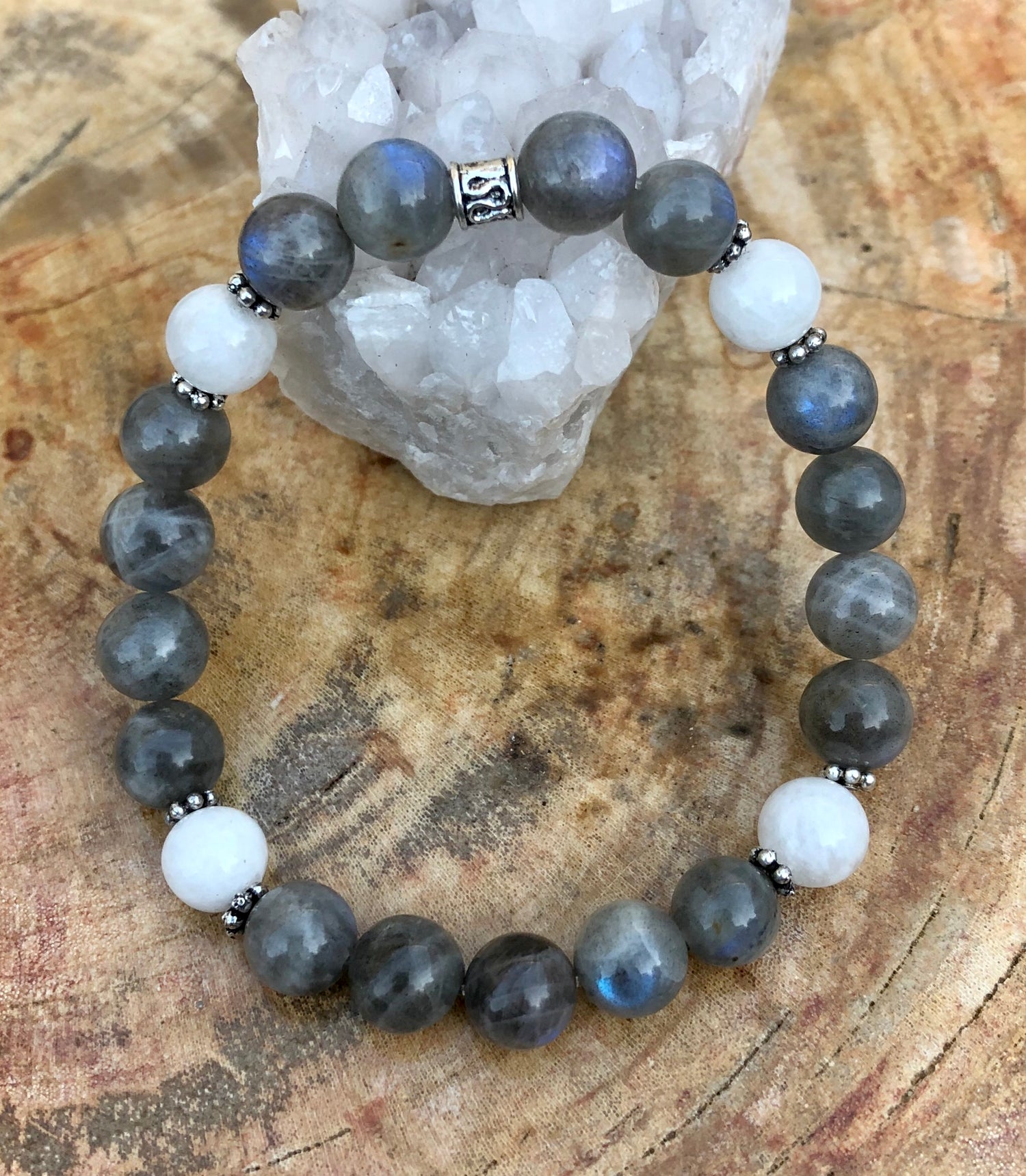 Blue flash labradorite and rainbow moonstone stretch bracelet featuring vibrant stones on a clear elastic band.
