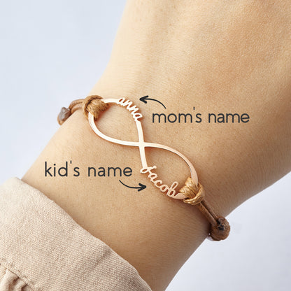 Green Millie mom bracelet with infinity design featuring engraved kids&