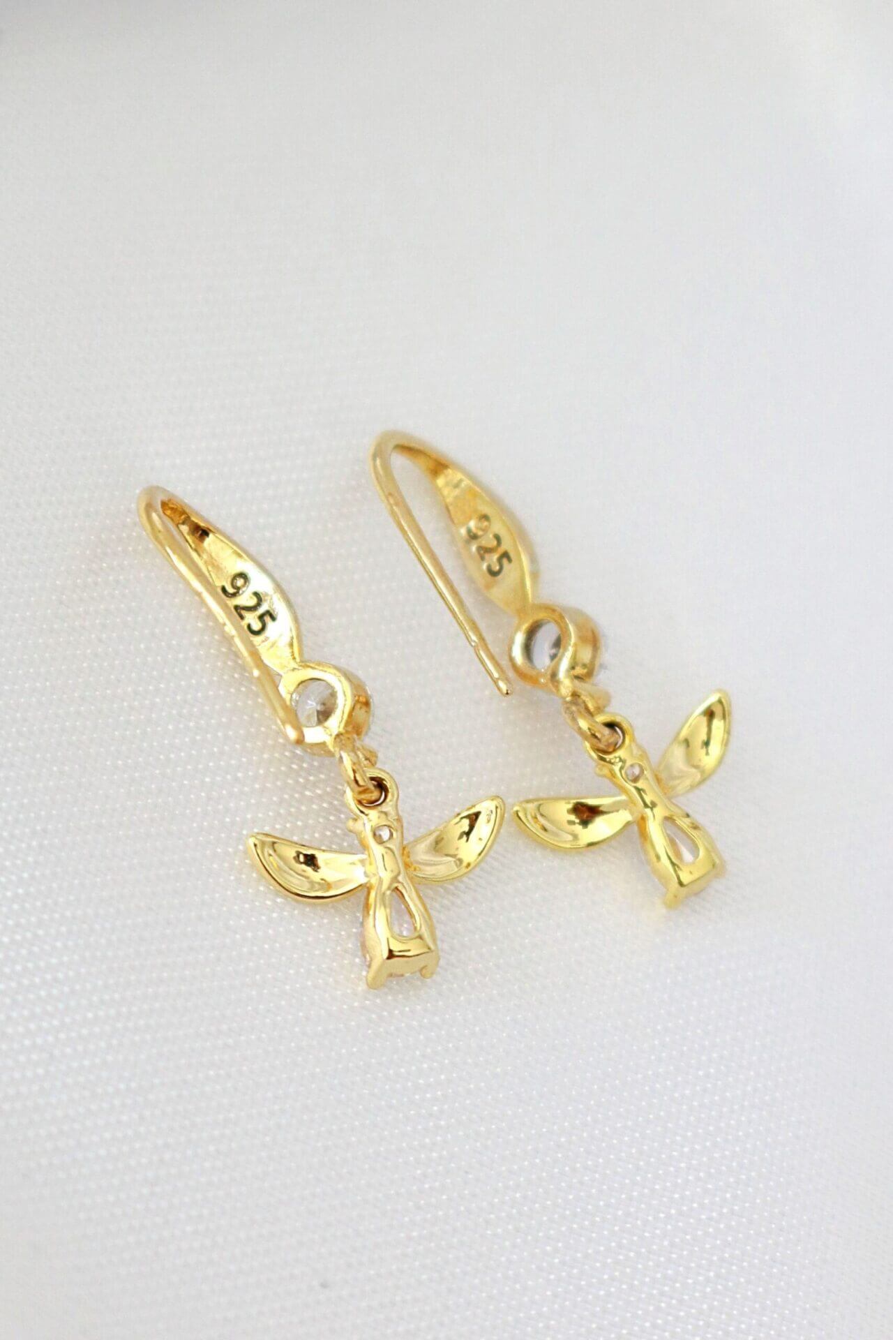 Ultramarine Birch 18 Karat gold bee hook earrings with intricate bee design and secure hook closure, elegant jewelry accessory.