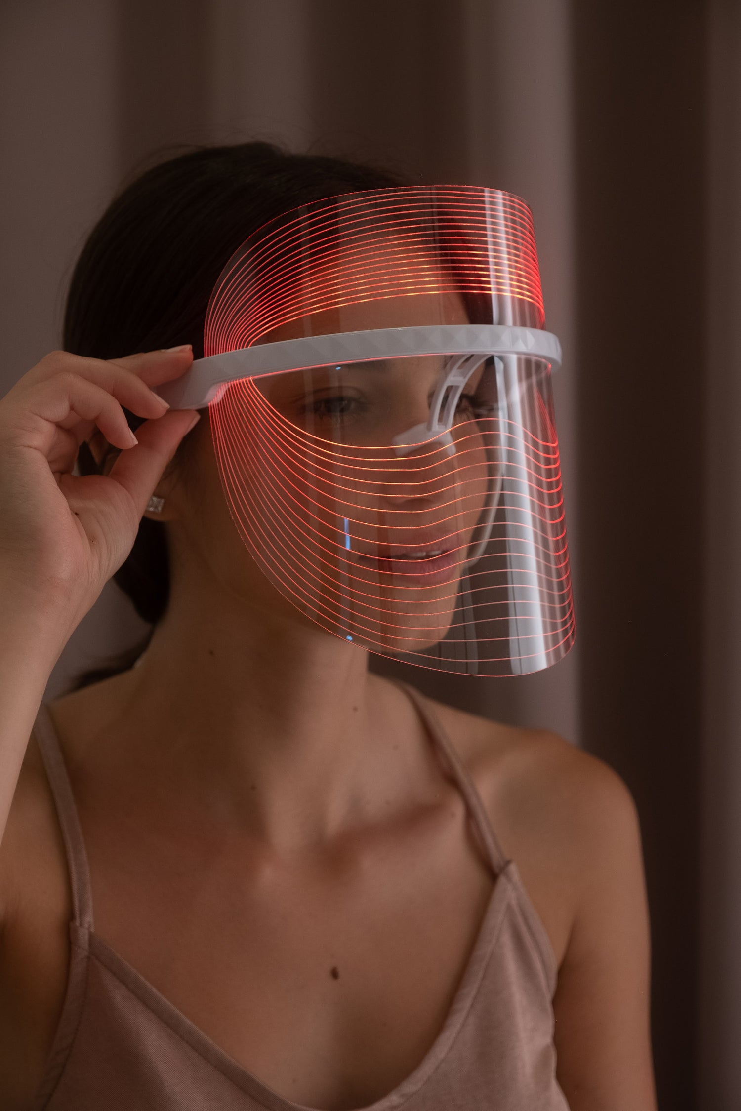 Scarlet Chrysippus Cocoon Skin Enlightenment LED Face Mask showing a sleek white healthcare mask with adjustable straps.