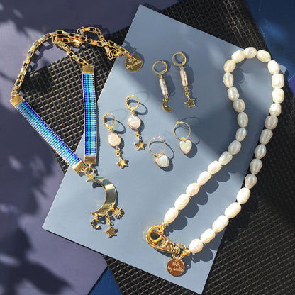 Yellow Athena crystal moon earrings featuring sparkling moon-shaped crystal pendants hanging from delicate hooks.
