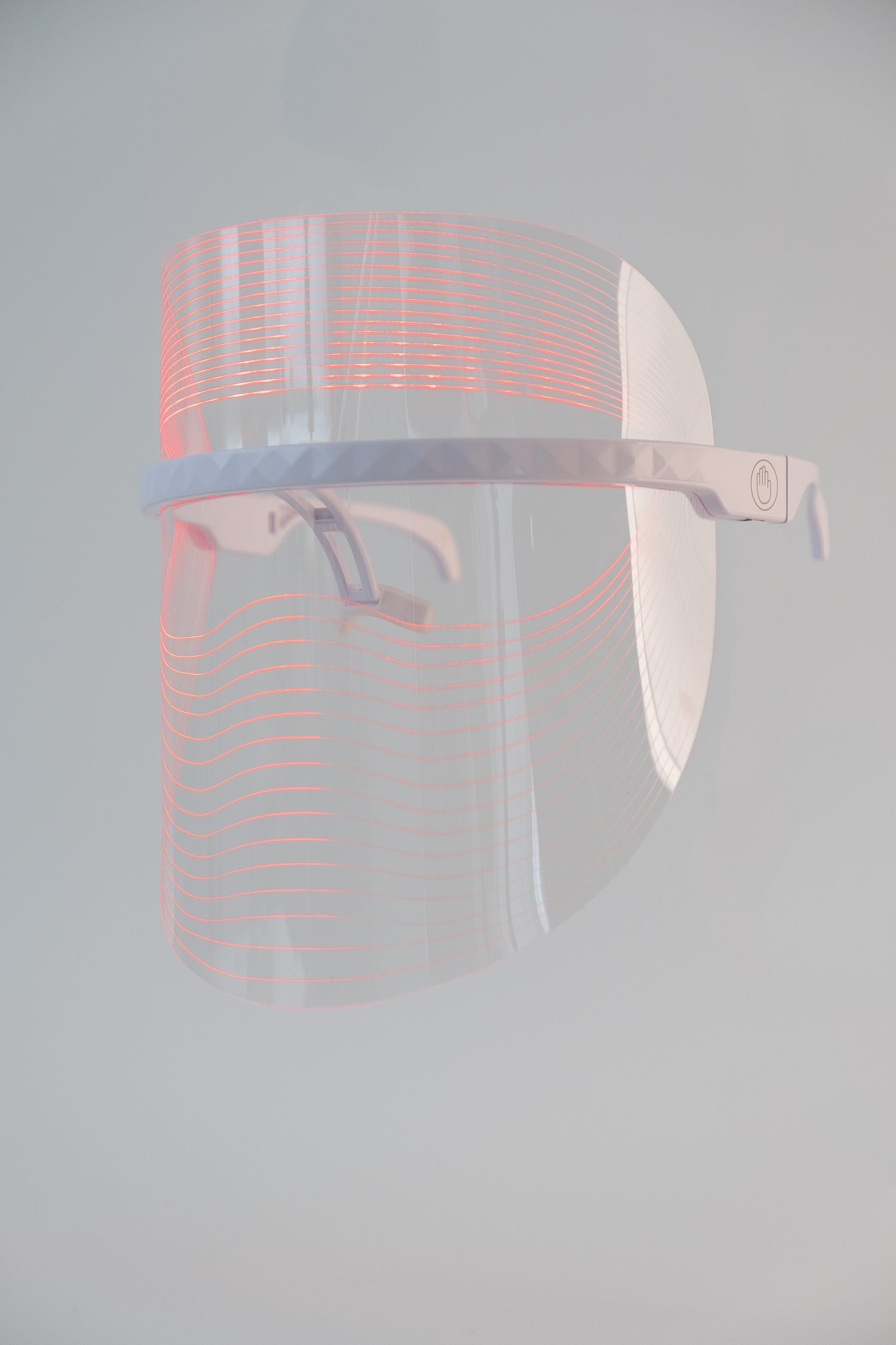 Scarlet Chrysippus Cocoon Skin Enlightenment LED Face Mask with adjustable straps and LED light panels for skincare treatment.