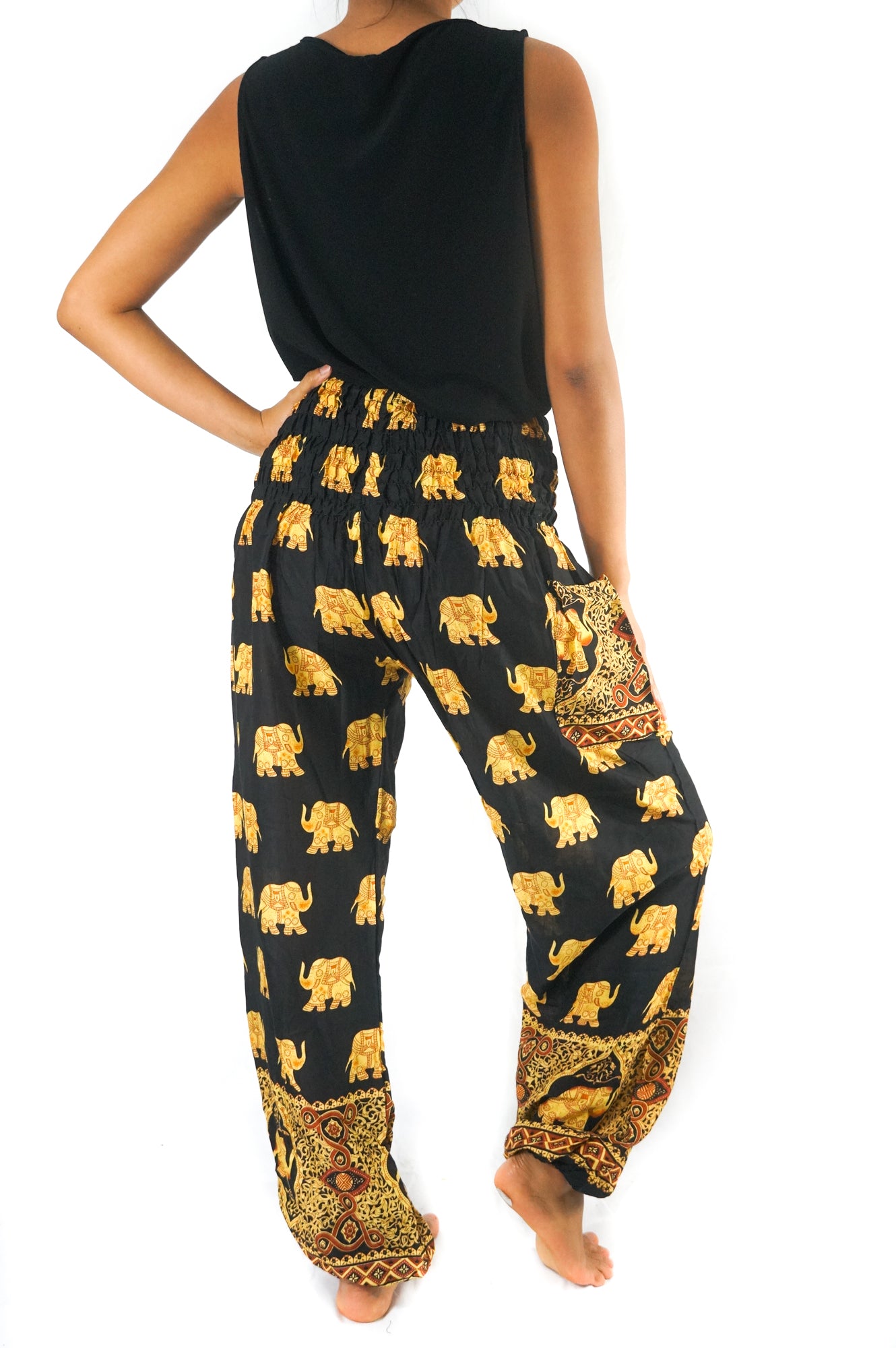 Black elephant print boho pants for women by Tan Smokey, featuring hippie style and comfortable yoga-inspired design.