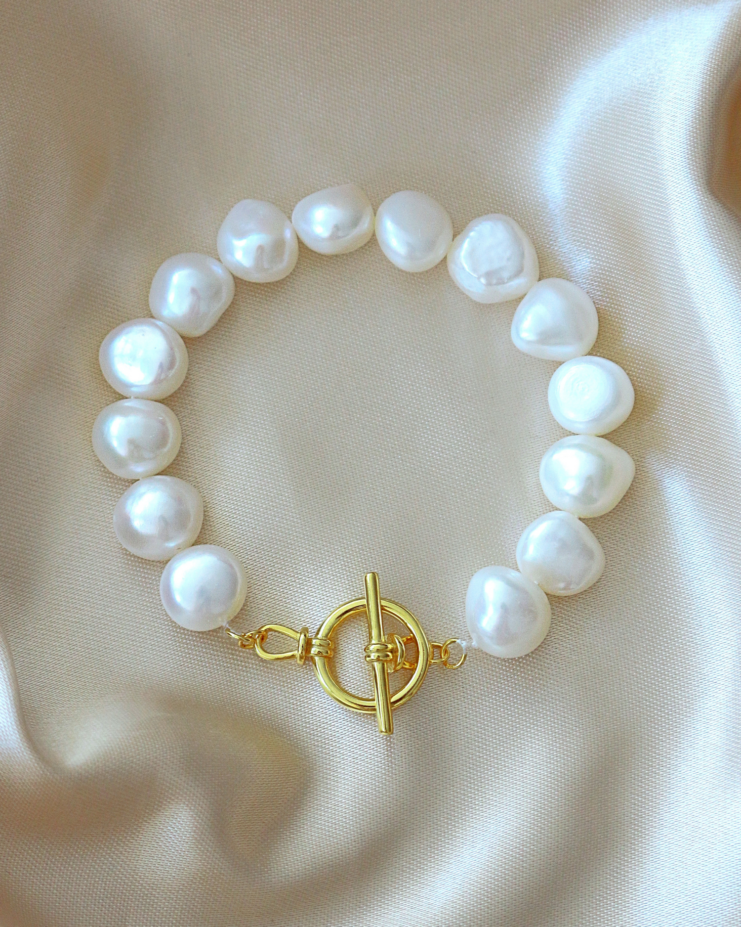 Baroque genuine freshwater pearl and 925 sterling silver bracelet by Ultramarine Birch, featuring elegant pearls and silver accents.