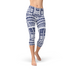Maroon Sooty Polynesian Maori tattoo Capri leggings featuring bold black tribal patterns on lightweight fabric.