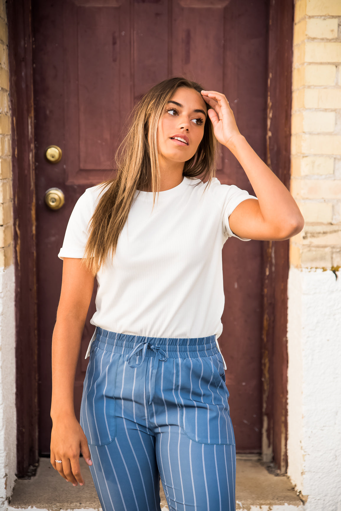 White DT Alyssa Rib Knit Split Hem Tee by Lavender Danae, featuring a ribbed texture and stylish split hem detail.