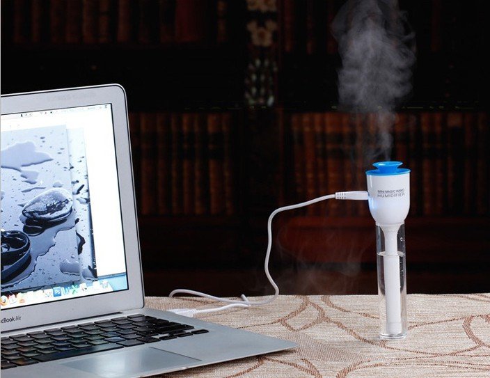 Fuchsia Molly Mini USB magic wand humidifier for automotive use, compact device emitting mist for car interior comfort.
