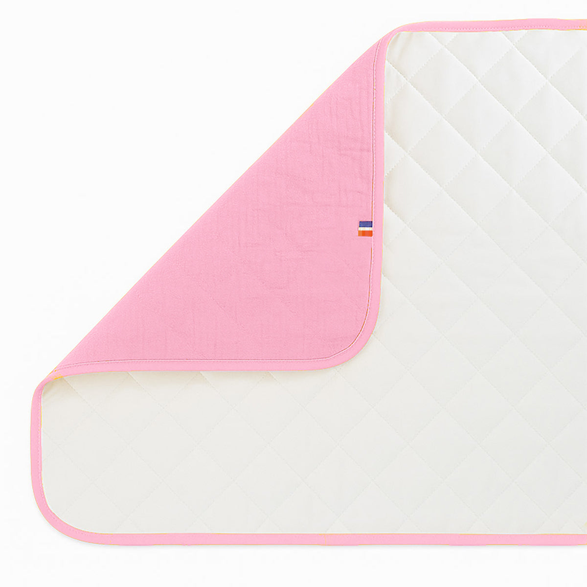 Pink Nomadic changing mat for kids and babies by Chocolate Briseis, soft and portable with a comfortable surface for diaper changes.