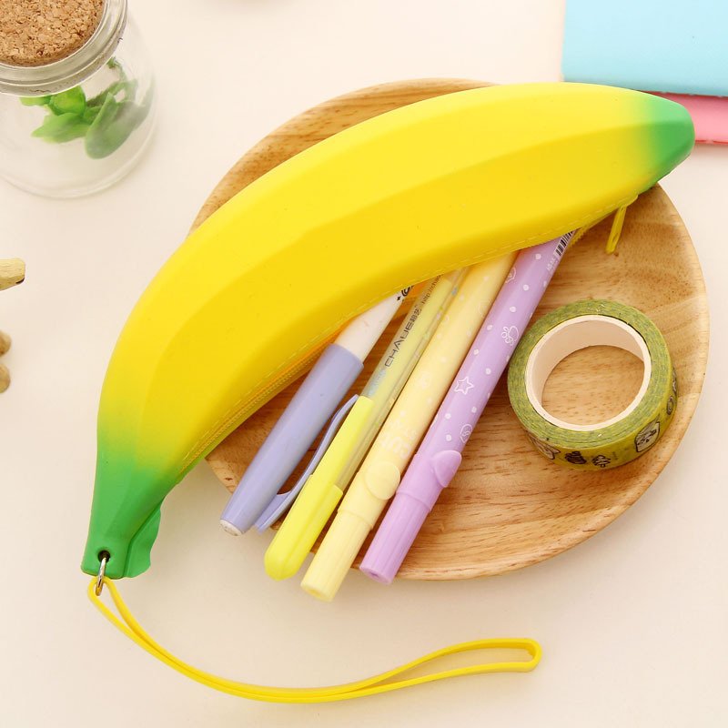 Fuchsia Molly banana design wallet featuring a bright yellow banana pattern on a compact leather wallet.