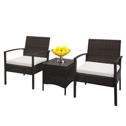 Lilac Milo rattan coffee table from the home garden furniture set, with a glass top and surrounding woven rattan seating area.
