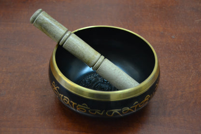 Handmade Nepal Tibetan Buddhist brass singing bowl with intricate carvings, used as a diffuser or decorative spiritual item.