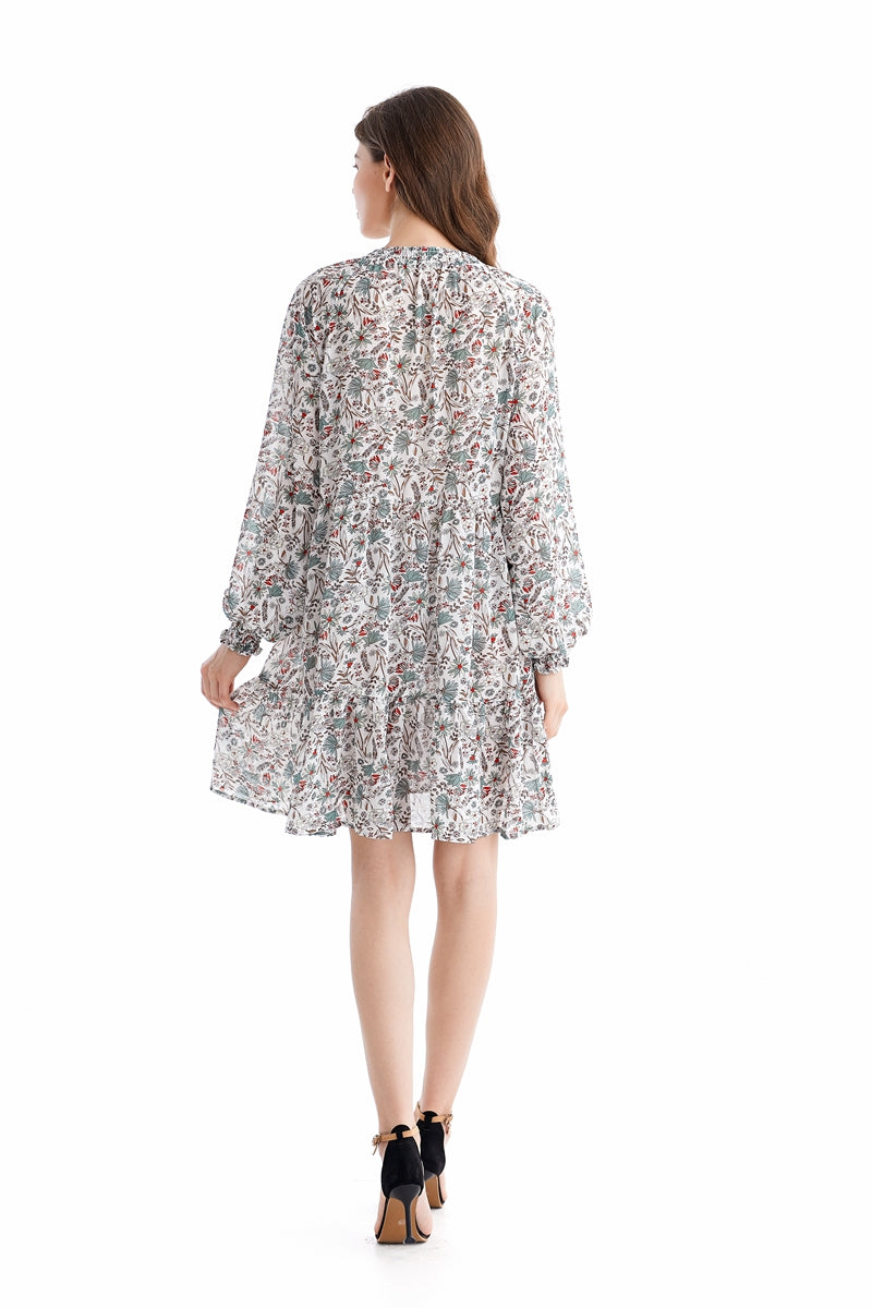 Teal Simba chiffon dress with loose waist and printed design, showcasing elegant, flowing fabric and stylish temperament.