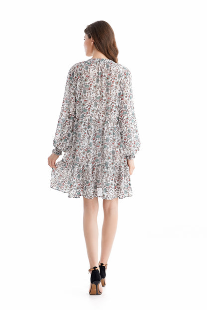Teal Simba chiffon dress with loose waist and printed design, showcasing elegant, flowing fabric and stylish temperament.
