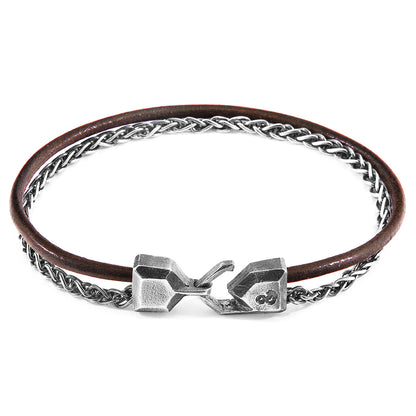 Mocha brown staysail mast silver and round leather bracelet by Magenta Sooty with silver accents and round leather details.