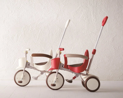 Taupe Pear Evolutive Tricycle for biking, featuring a sturdy frame, comfortable seat, and three-wheel design for stability.