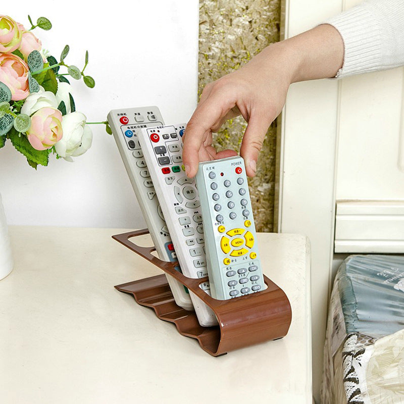 Fuchsia Molly remote controller organizer with multiple compartments for easy storage and organization of remote controls.