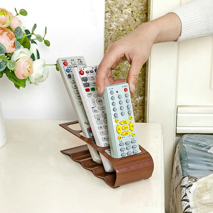 Fuchsia Molly remote controller organizer with multiple compartments for easy storage and organization of remote controls.