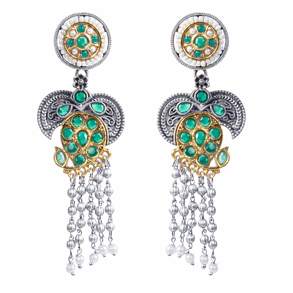 Gray Chloe designer earrings featuring intricate gold and silver details, showcasing elegant dangle style on a plain background.