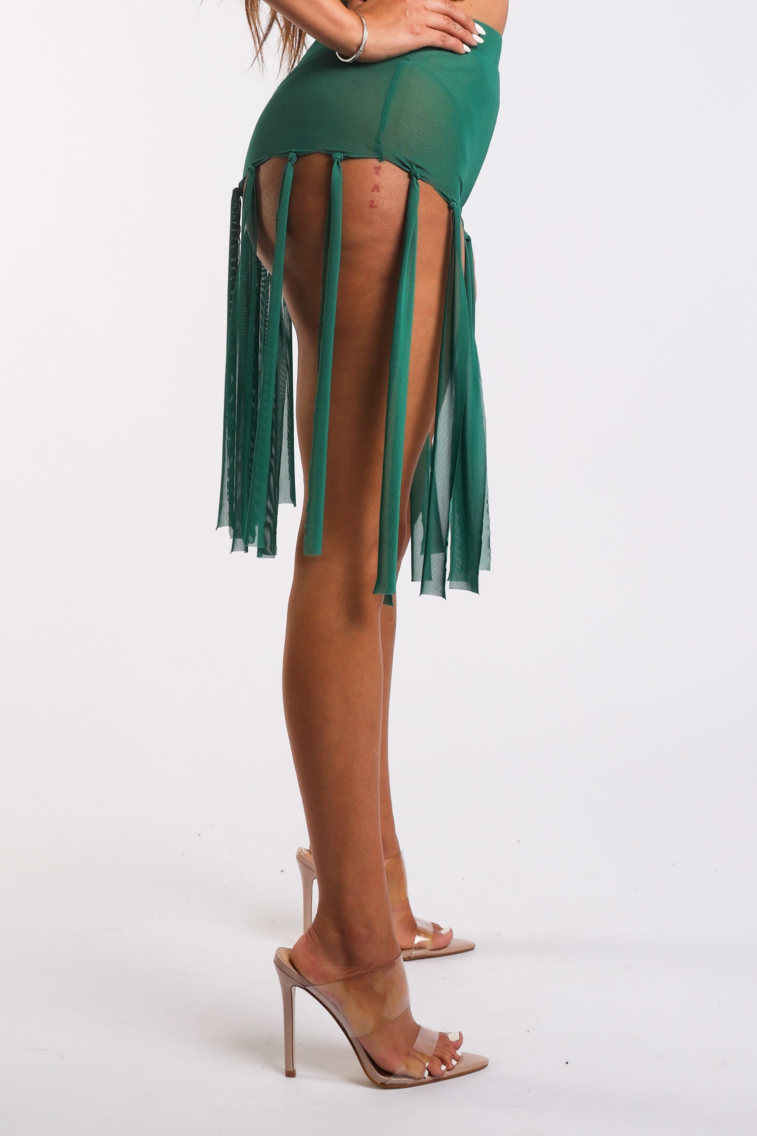 Green fringed mesh shorts by Puce Juniper, sexy and stylish, perfect for party-ready looks.