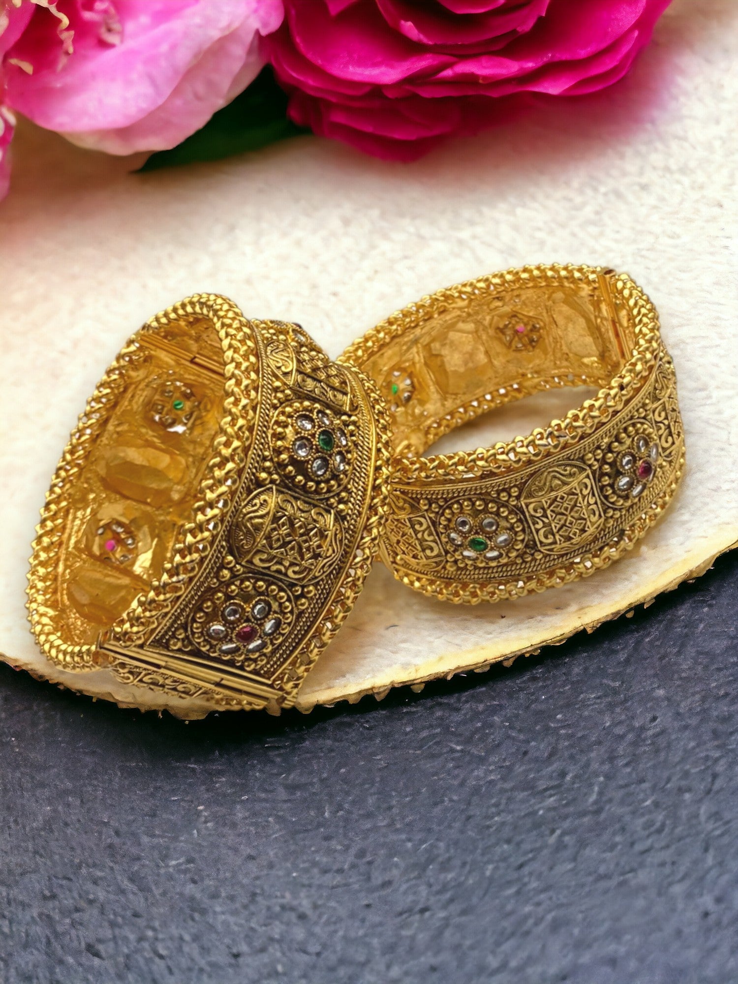 Set of gold-plated Indian bangles with intricate designs from Gray Poseidon, showcasing traditional and modern bracelet styles.