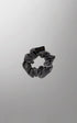 Silk hair ties by Burgundy Clover in gray, golden, and white, shown in medium and large sizes, arranged on a white background.