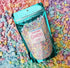 Colorful Orchid Missy Bath Bomb Confetti in a clear container, perfect for relaxing bath and beauty routines.