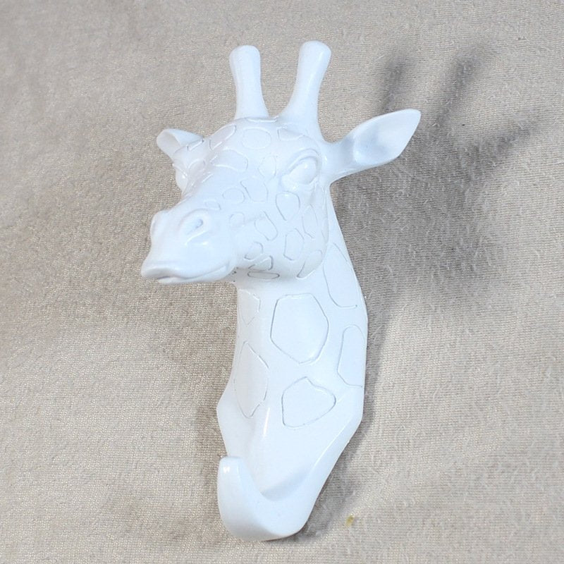 Fuchsia Molly resin giraffe head hook mounted on wall, decorative home and garden accessory with animal design.