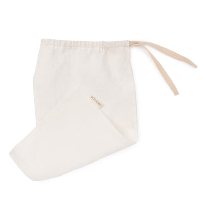 Off-white linen bread bag by Biotite, kitchen storage accessory with a soft, natural fabric design for fresh bread storage.