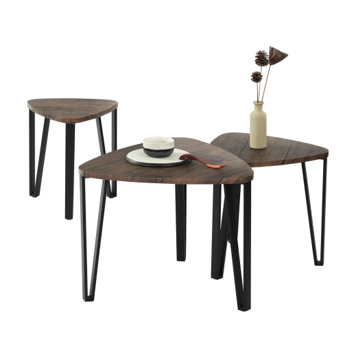 Set of three nesting triangle side tables by Teal Simba, modern stacking coffee tables with sleek geometric design.