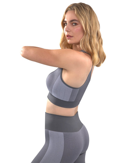 Grey Arleta Seamless Sports Bra by Lazurite, designed for women, shown on a hanger with smooth, stretchy fabric and supportive fit.