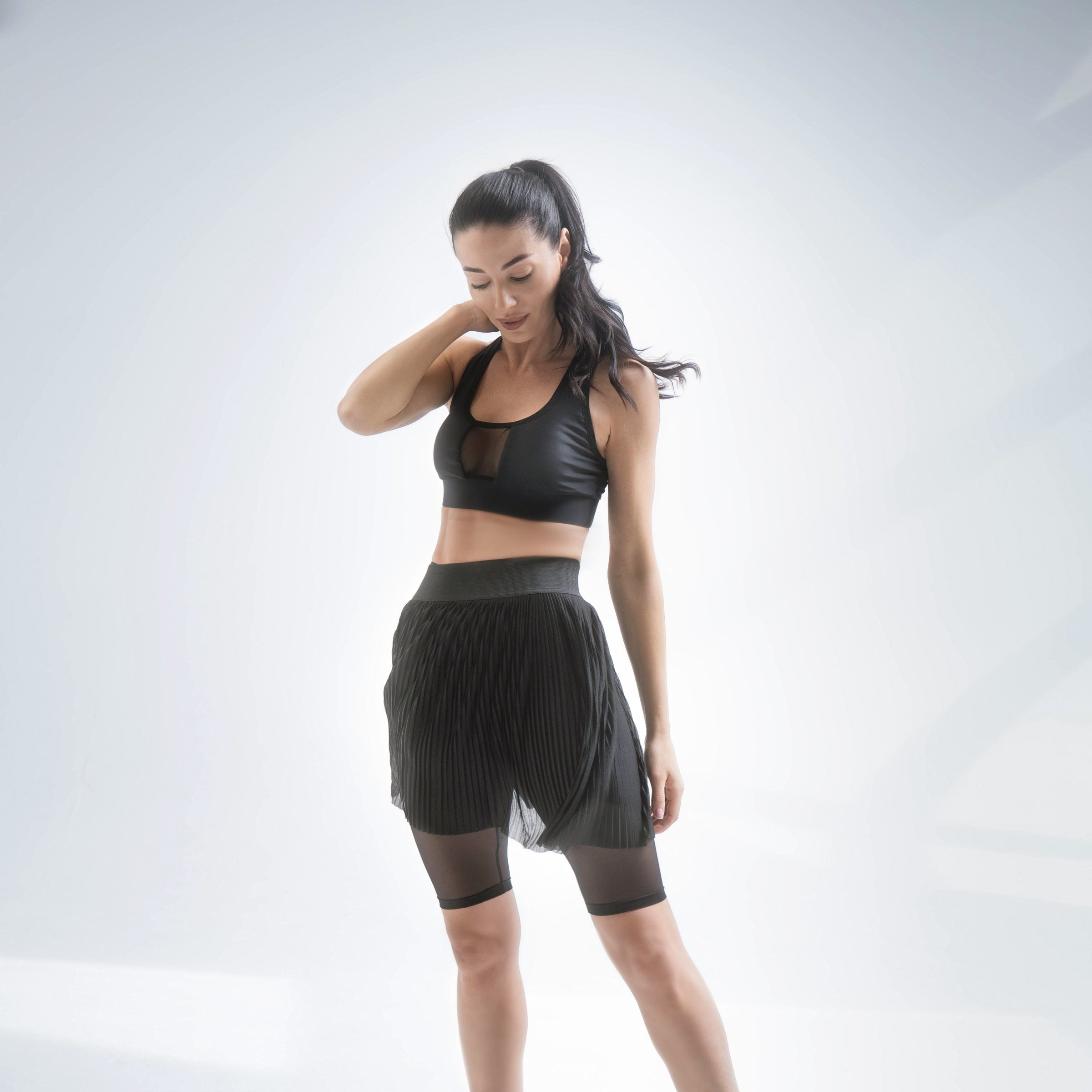 Indigo Thalassa MINI PLESSY mesh skirt with layered design and adjustable waistband, displayed on a mannequin.