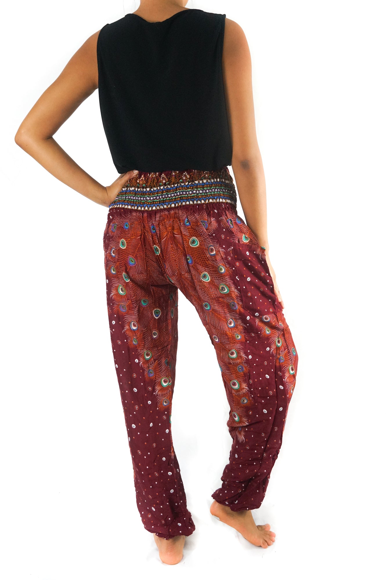 Burgundy PEACOCK women’s boho yoga pants by Tan Smokey, featuring a relaxed fit and vibrant peacock print design.