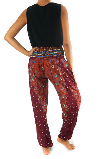 Burgundy PEACOCK women’s boho yoga pants by Tan Smokey, featuring a relaxed fit and vibrant peacock print design.
